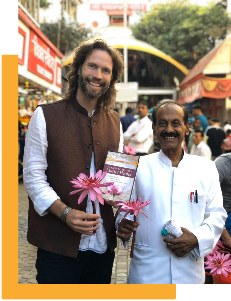 Dr. Clint G. Rogers and Dr. Naram with book Ancient Secrets of a Master Healer
